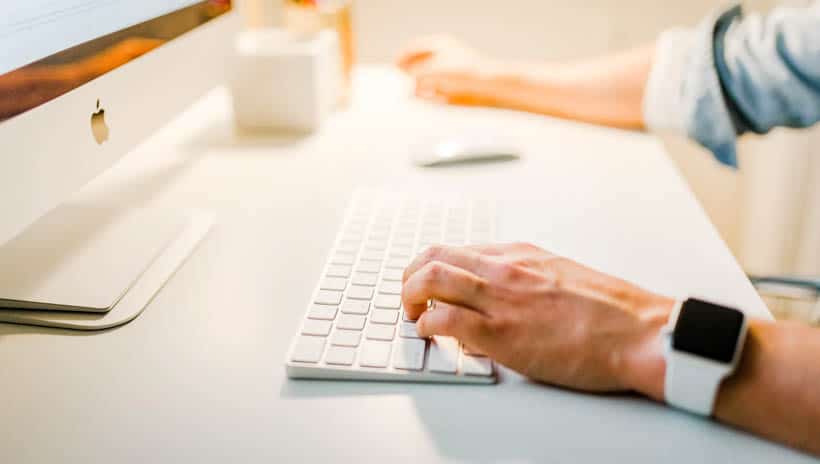 Person typing on computer