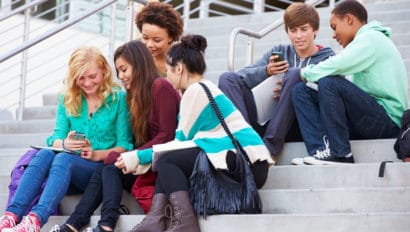 Students chatting on building steps