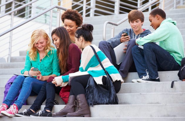 Students chatting on building steps