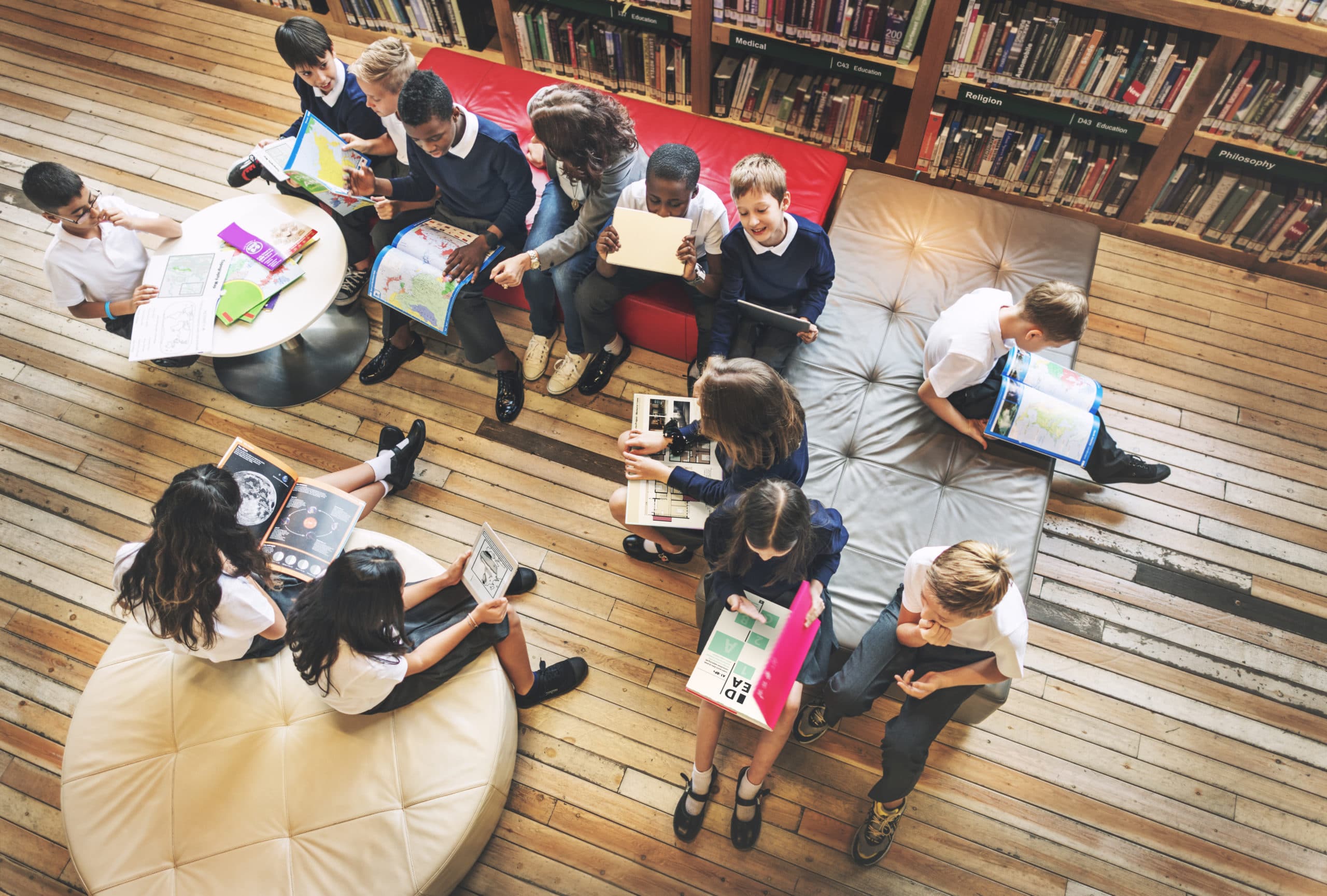 Students in library smiling