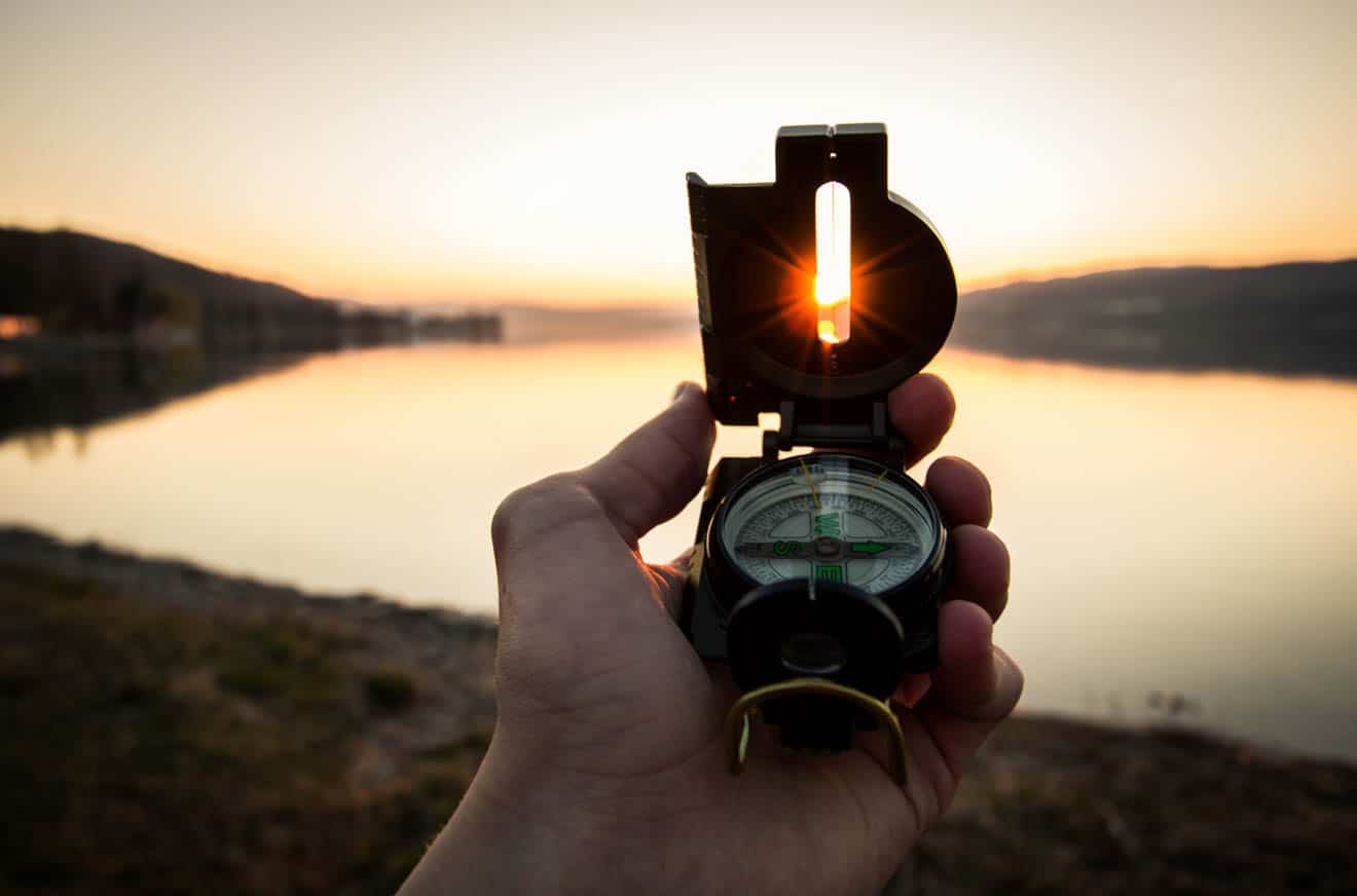 Person holding a compass