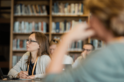 Woman in classroom looking ahead